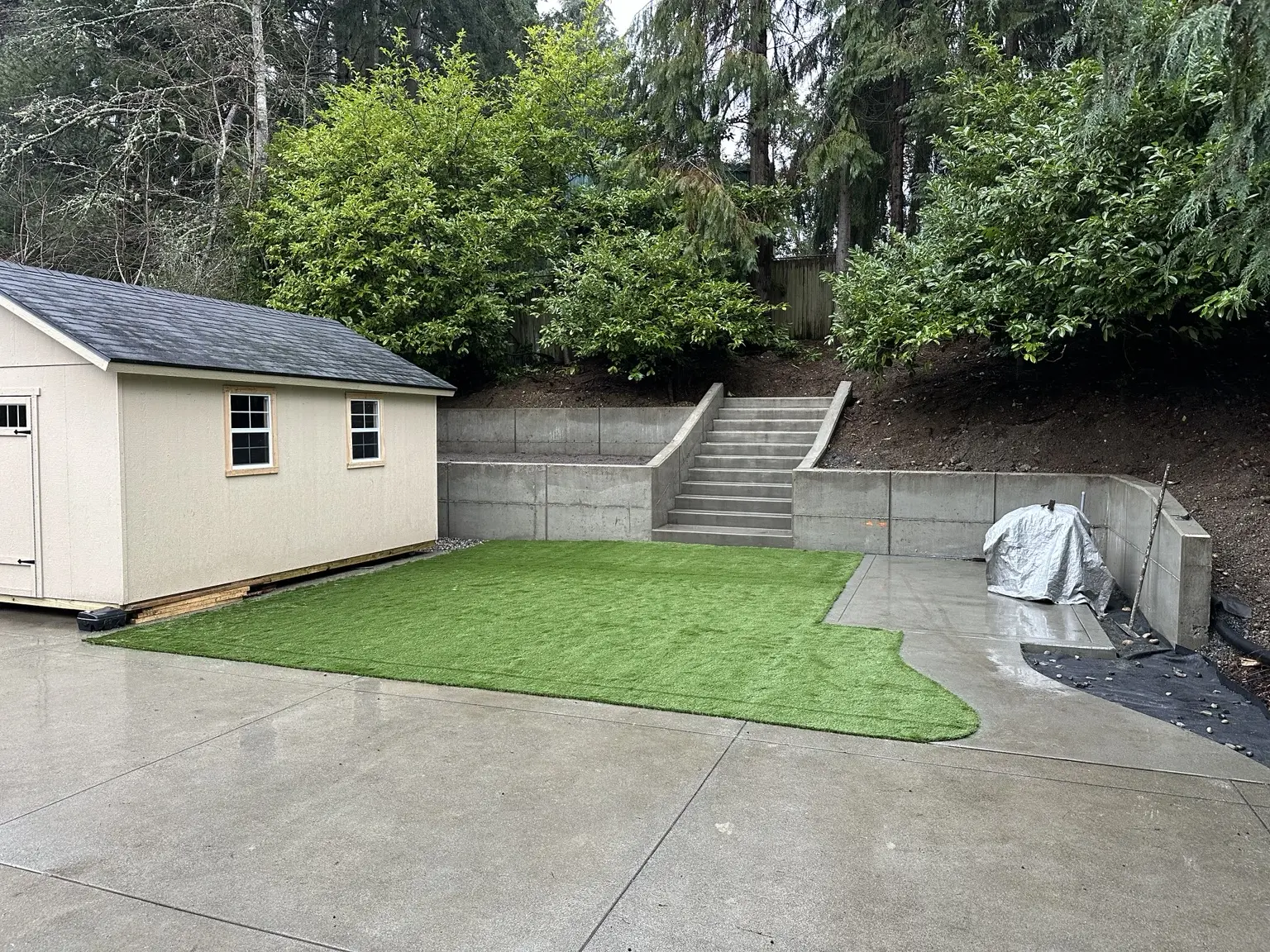 Concrete retaining wall, steps and patio